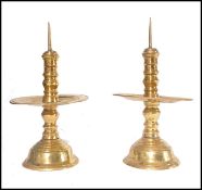 A pair of Dutch brass pricker candlesticks, possib