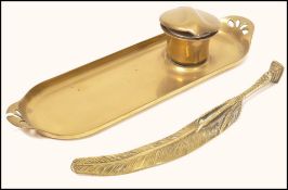 A 19th century brass pen tray with fitted inkwell