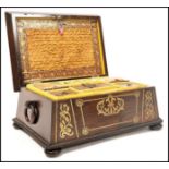 A Regency rosewood brass inlaid work box raised on