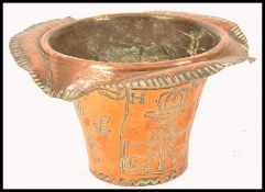 A large copper ice bucket of French origin bearing