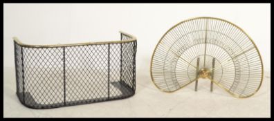 A 19th century Victorian small brass railed and mesh nursery fire fender along with a brass fan