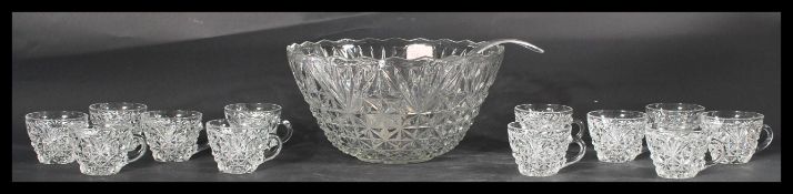 A vintage 20th Century glass punch bowl and glasse