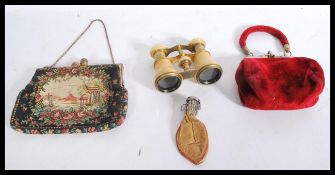 A vintage cased set of opera glasses in velvet purse together with a white metal and leather