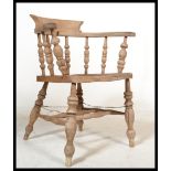 A Victorian beech and elm smokers bow armchair bei