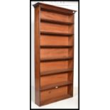 A 19th century Victorian tall walnut bookcase cabinet. The cabinet with fixed shelves rising up