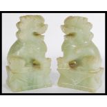 A pair of early 20th century jade or jadeite Fu do