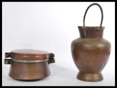 A 19th century copper traveling pan and cover along with a double lipped milk churn with fixed