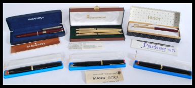 A group of vintage fountain pens to include three cased Staedtler pens a boxed Papermate pen , Boxes