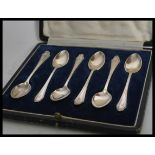 A set of six early 20th century silver hallmarked coffee tea spoons complete in fitted cutlery case.