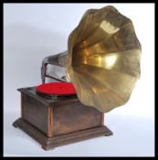 A vintage oak cased table top gramaphone having a