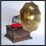 A vintage oak cased table top gramaphone having a