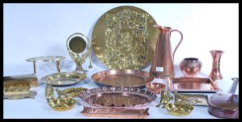 A collection of copper and brass wares to include