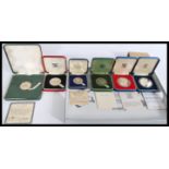 A group of silver proof coins to include Bristol 600 , John Pinches Prince Charles 1969 , Redland