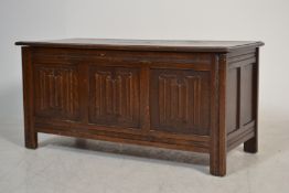 A 20th century Jacobean revival oak coffer chest w