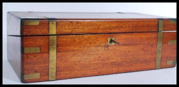 A 19th century Victorian brass bound mahogany writing slope having hinged lid opening to reveal a