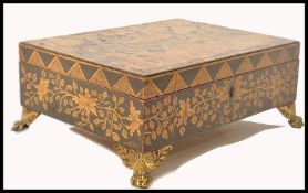 A 19th century penwork Chinese workbox being beati