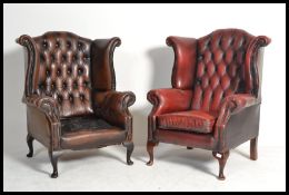 A good pair of Oxblood Chesterfield button back wing armchairs being raised on cabriole legs with