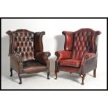 A good pair of Oxblood Chesterfield button back wing armchairs being raised on cabriole legs with