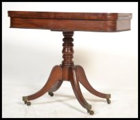 An early 19th century Georgian / Regency card - mahogany games table being raised on a quadruped