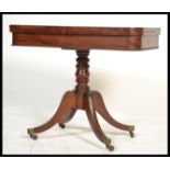 An early 19th century Georgian / Regency card - mahogany games table being raised on a quadruped