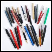 A collection of vintage fountain pens to include S