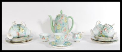 A vintage early 20th century art deco tea service by Shelley. The tea set in the ' Melody '