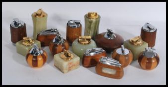 A collection of vintage Ronson table top lighters some in alabaster mounts and the others in