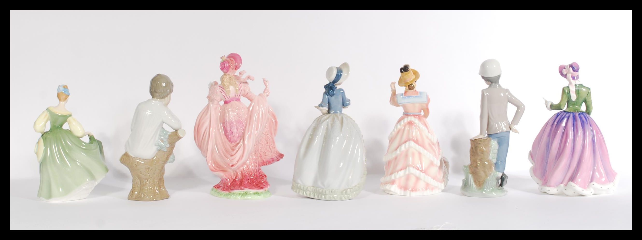 A group of seven Coalport Royal Doulton and Lladro Nao figurines to include two Nao boys and one Nao - Image 3 of 7