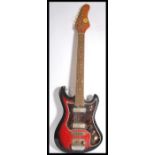 A vintage Teisco Top Twenty six string electric guitar having a shaped flame body. Measures 98.5