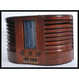 A vintage early 20th Century GEC large mahogany cased valve radio Model No BC4750 D shaped case with