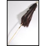 A Victorian 19th century fringed silk lady's carriage parasol with ivory and bone folding handle,