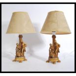 A pair of gilt cast resin classical table lamps wi