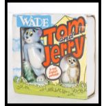 A vintage retro Wade porcelain Tom & Jerry figure set in original packaging. Highest measures 9 cm.