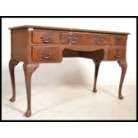 A 1950's Queen Anne revival mahogany writing desk