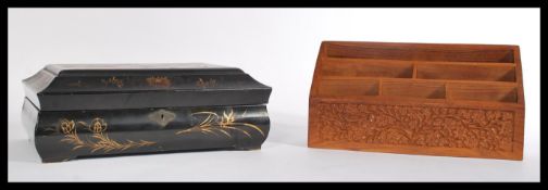 A Japanese lacquer work box, decorated with landscapes hinged top opening to reveal a fully