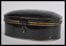 A 19th century Japanned and gilded metal wig tin o