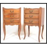 A pair of French walnut bedside chests of drawers