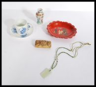 A dealers lot of Chinese items to include a 19th century Kangxi period tea cup and saucer, a