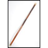 A carved Japanese walking stick cane having a bone