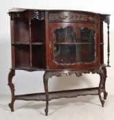 An Edwardian mahogany aesthetic movement display cabinet chiffonier raised on cabriole legs with