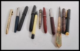 A collection of vintage pens to include Valentine 14k gold nip , Sheaffer 12ct gold filled ,