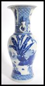 A 19th century Chinese blue and white vase having a bulbous body with tapered neck flared rim and