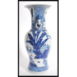 A 19th century Chinese blue and white vase having a bulbous body with tapered neck flared rim and