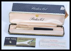 A vintage boxed Parker 61 cartridge fountain pen with rolled gold cap in original box complete