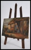 A 19th century Victorian small oil painting on canvas of a cottage scene with a wooden easel