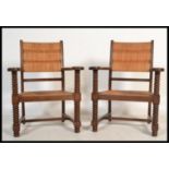 A set of country oak and rattan weave carver armch