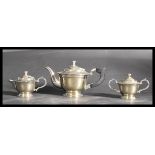 An early 20th century silver plated three piece ge