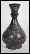 A 19th century bronze baluster vase. The globular