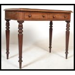 A Victorian mahogany writing table desk being rais