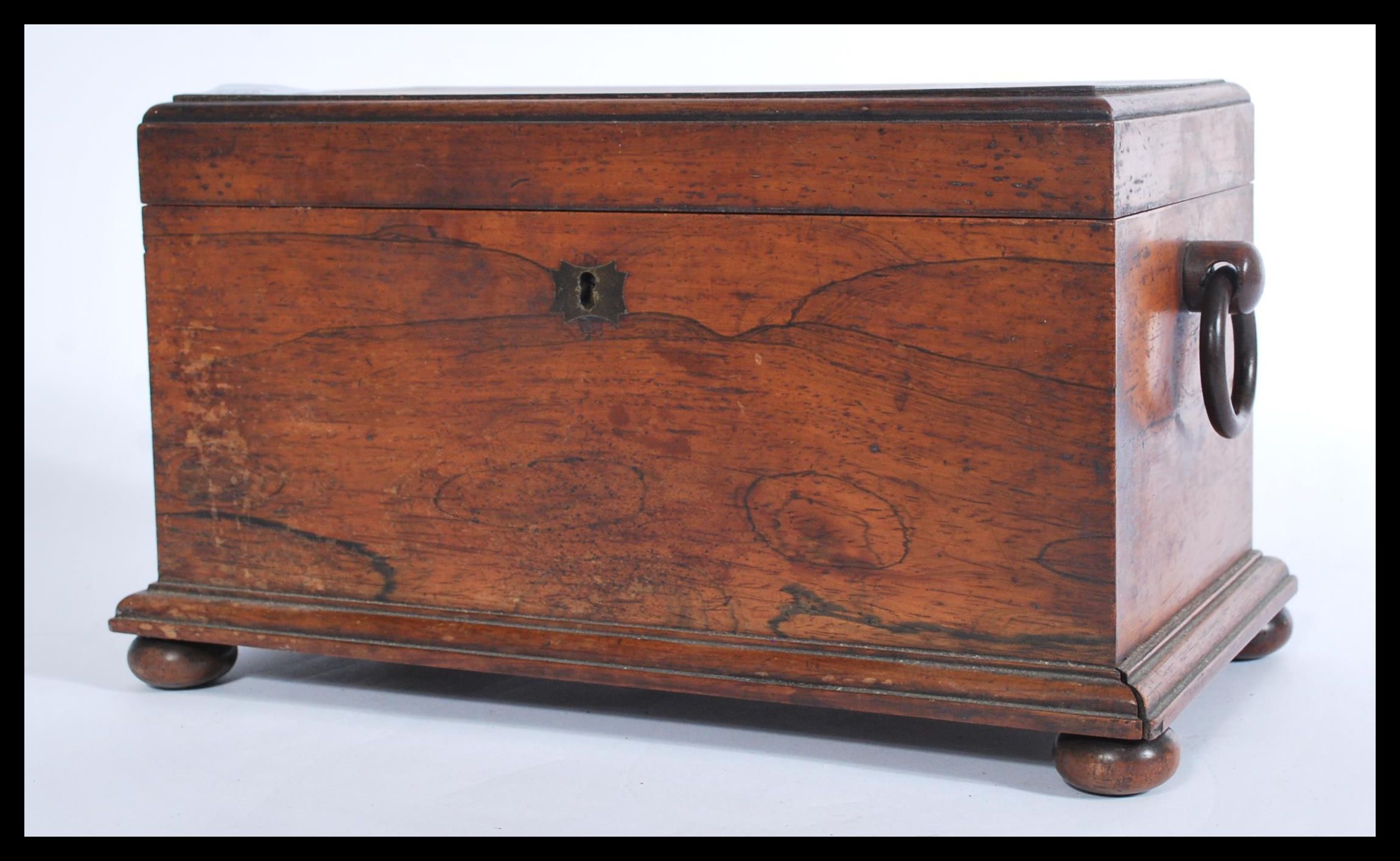 A Victorian rosewood sarcophagus shaped tea caddy, with a quarter reel moulded border, hanging